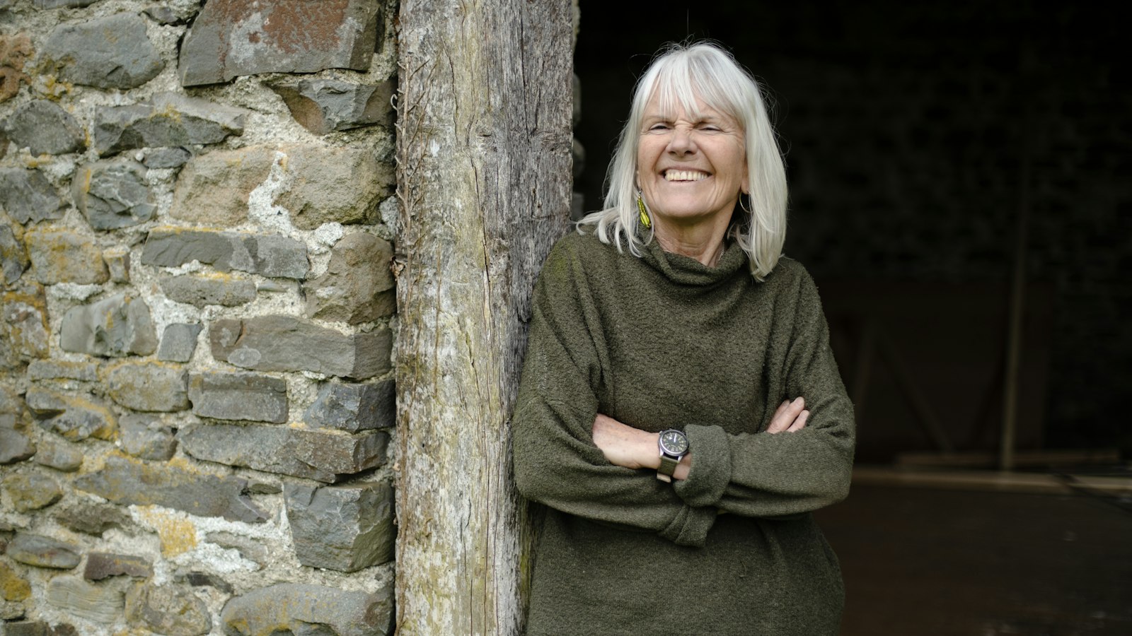 Best supplements for women over 50: smiling woman with gray hair outdoors